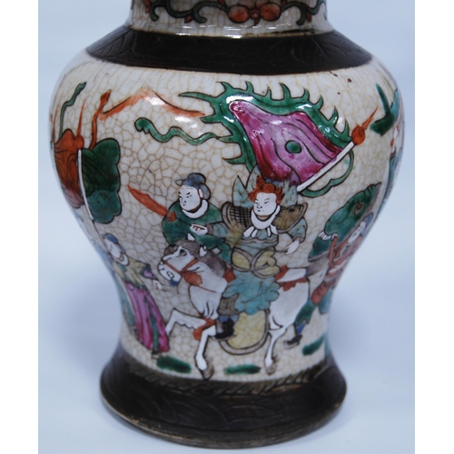 289 - Pair of Chinese crackle glazed baluster vases and covers (20th century) decorated with battle scenes... 