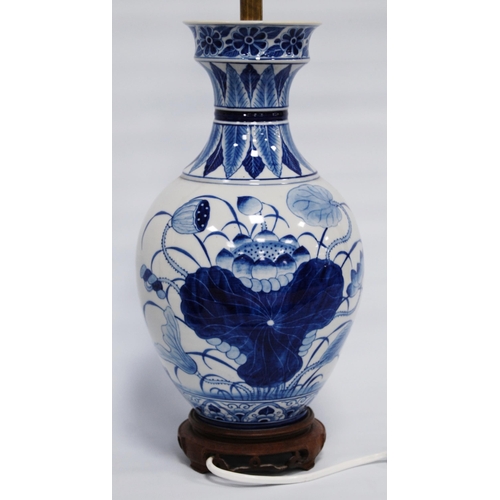 292 - Oriental blue and white porcelain vase/lamp in the Kangxi period style with all over floral panels, ... 