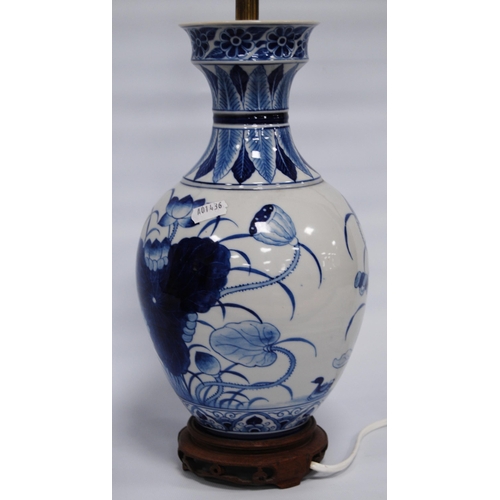 292 - Oriental blue and white porcelain vase/lamp in the Kangxi period style with all over floral panels, ... 