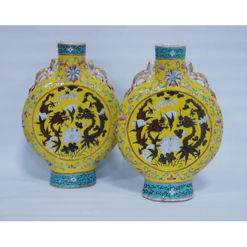 294 - Pair of Chinese famille rose moon flasks, probably late Qing/Republic period, the central panel with... 