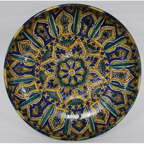 296 - Islamic Moroccan tin glazed charger, c. late 19th/early 20th century, painted in turquoise, blue, gr... 