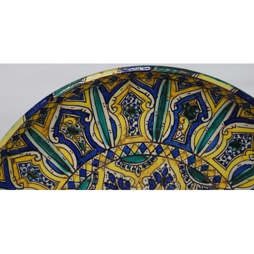 296 - Islamic Moroccan tin glazed charger, c. late 19th/early 20th century, painted in turquoise, blue, gr... 