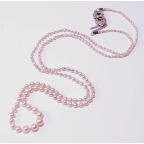 95 - Necklace of graduated pearls on white gold snap with rose diamonds.