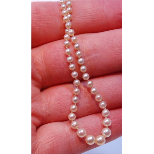 95 - Necklace of graduated pearls on white gold snap with rose diamonds.