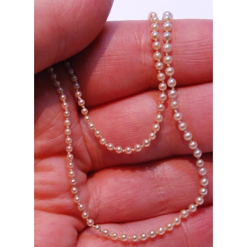 95 - Necklace of graduated pearls on white gold snap with rose diamonds.