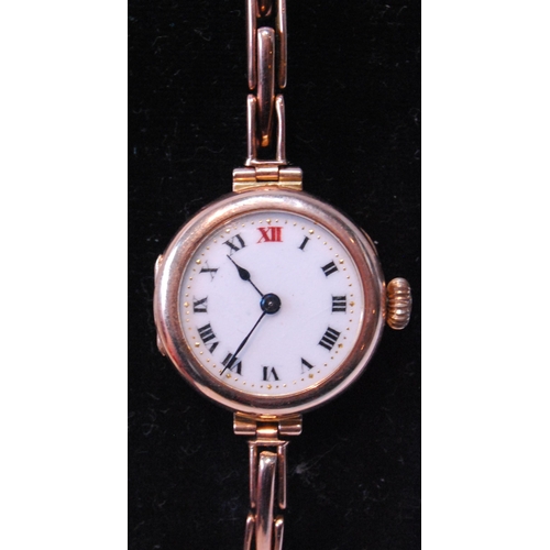 147 - Lady's 9ct gold cylinder watch on expanding bracelet, 1928.