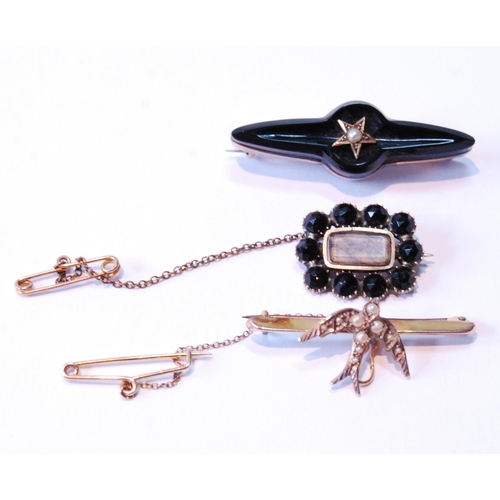 99 - Gold brooch with pearl-set dove, a late Georgian brooch with black tourmaline and another.  (3)