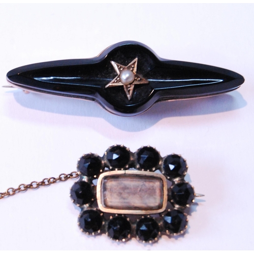 99 - Gold brooch with pearl-set dove, a late Georgian brooch with black tourmaline and another.  (3)