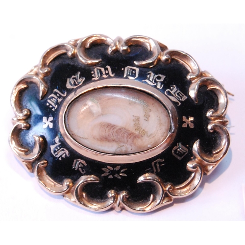 100 - Victorian gold mourning brooch and a similar mounted onyx cross.  (2)