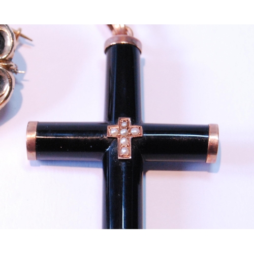 100 - Victorian gold mourning brooch and a similar mounted onyx cross.  (2)