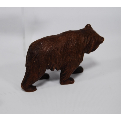 182 - Black Forest bear blotter with bear surmount and three Black Forest graduated bear figures, the larg... 