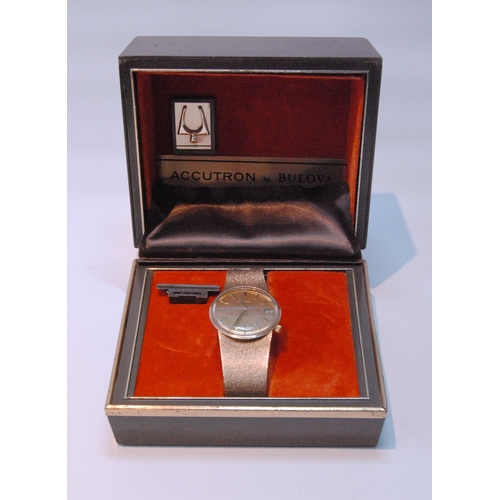 149 - Gent's 9ct gold Bulova Accutron watch on Milanese bracelet, 1973, in original box, 73g gross.