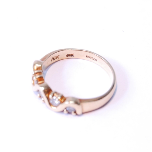 104 - Gold half hoop-style ring with zigzag of diamond brilliants, in 18ct gold, size K, 3.7g gross.