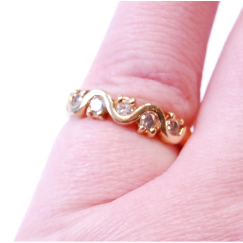 104 - Gold half hoop-style ring with zigzag of diamond brilliants, in 18ct gold, size K, 3.7g gross.