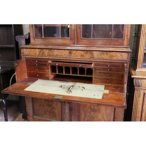 662 - 19th century mahogany secretaire bookcase, the pediment cornice over two glazed doors with arrangeme... 