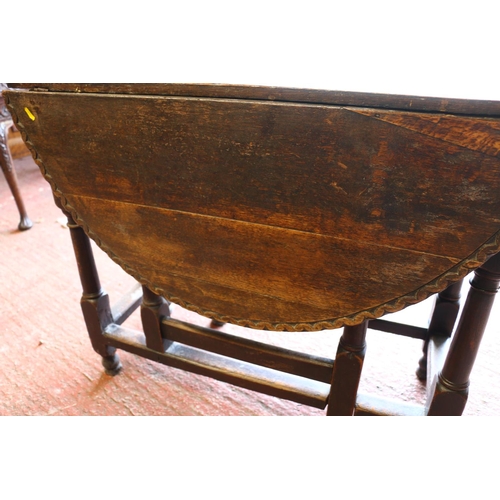 682 - Early 19th century oak Pembroke table, the oval top with piecrust edge, single drawer, raised on tur... 