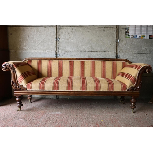 690 - Victorian mahogany sofa, with scrolled arms and acanthus detail, raised on turned supports terminati... 