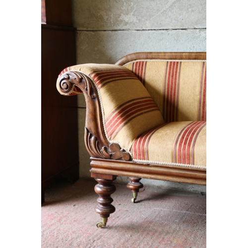 690 - Victorian mahogany sofa, with scrolled arms and acanthus detail, raised on turned supports terminati... 