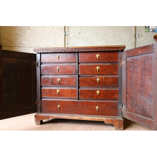 702 - 18th century French oak cabinet, with rectangular top, moulded edge, dentil cornice over two geometr... 