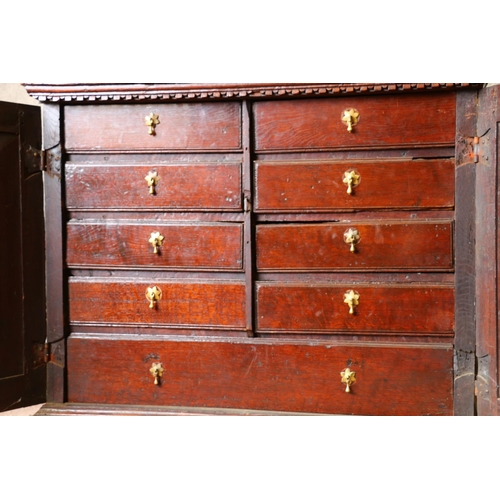 702 - 18th century French oak cabinet, with rectangular top, moulded edge, dentil cornice over two geometr... 