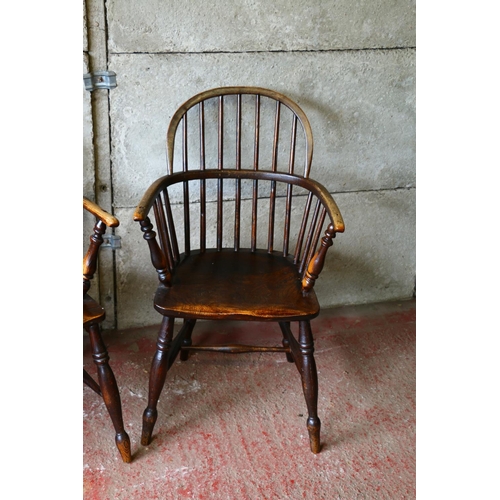 715 - Pair of 19th century elm Windsor chairs, with saddle seats, raised on turned supports united by H-st... 