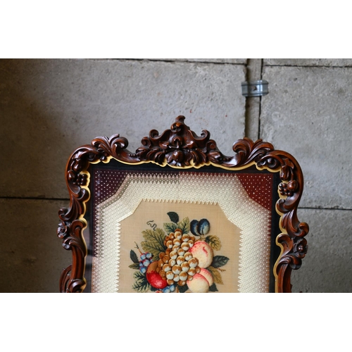 721 - Victorian tapestry and stumpwork panel depicting fruits, within  an elaborately carved  frame, 79 x ... 