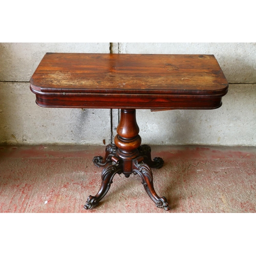 734 - Victorian mahogany fold-over card table, with revolving top, on turned and carved quadruped support,... 