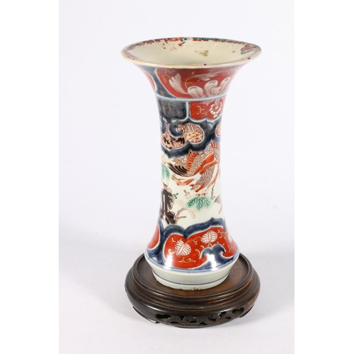 518 - Oriental porcelain gu shaped porcelain vase decorated in the Imari palate with phoenix, 25cm tall.