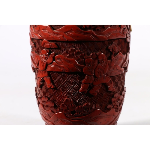 529 - Cinnabar Chinese vase depicting children playing, marked 