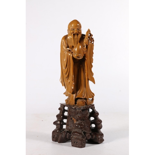 533 - 19th century carved Chinese soapstone figure of Shou Lao, on stone base, 28cm.