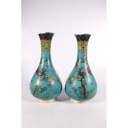 535 - Pair of Chinese bottle shaped vases with flared rims and birds on branches to field, red character m... 