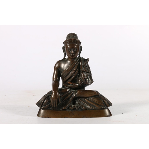 536 - Southeast Asian bronze figure of Buddha in Bhumisparsha, or Earth as Witness, position, 12cm.