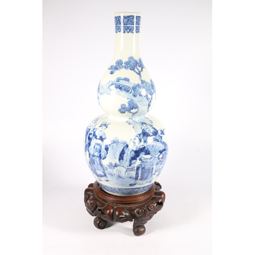 538 - Chinese double gourd blue and white vase depicting procession with noble figure riding guardian lion... 