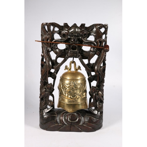 539 - Chinese bronze bell on three dragon carved stand, 44cm.