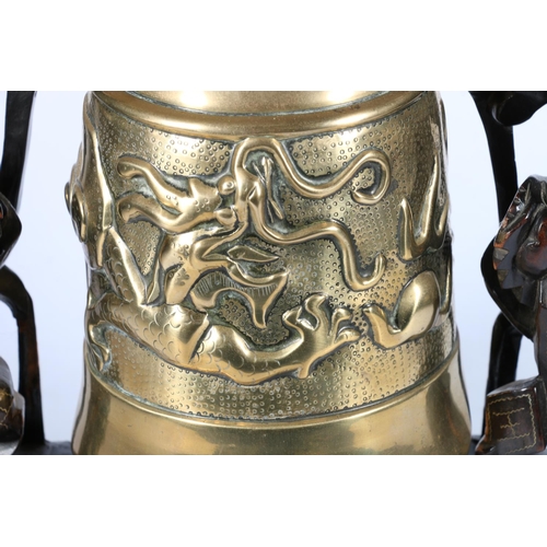 539 - Chinese bronze bell on three dragon carved stand, 44cm.