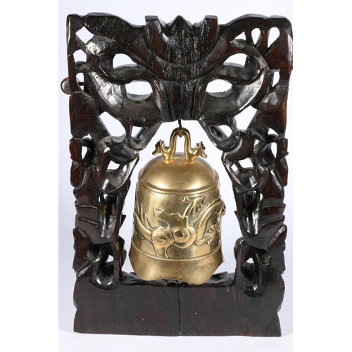 539 - Chinese bronze bell on three dragon carved stand, 44cm.