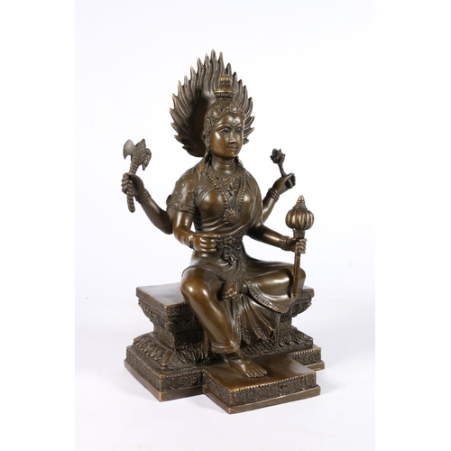 542 - Southeast Asian bronze figure of a seated goddess, 28cm.