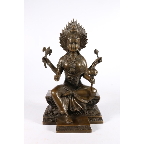 542 - Southeast Asian bronze figure of a seated goddess, 28cm.