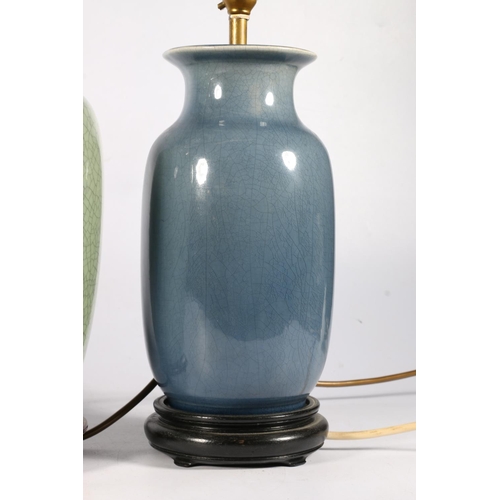 545 - Chinese celadon green crackle glaze effect table lamp with two others, tallest 32cm, on wooden stand... 