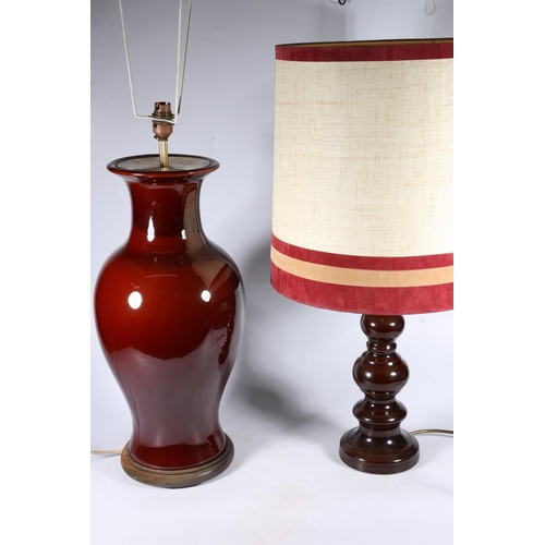 546 - Baluster shaped sang de boeuf table lamp, 50cm, and another of knopped form with shade.