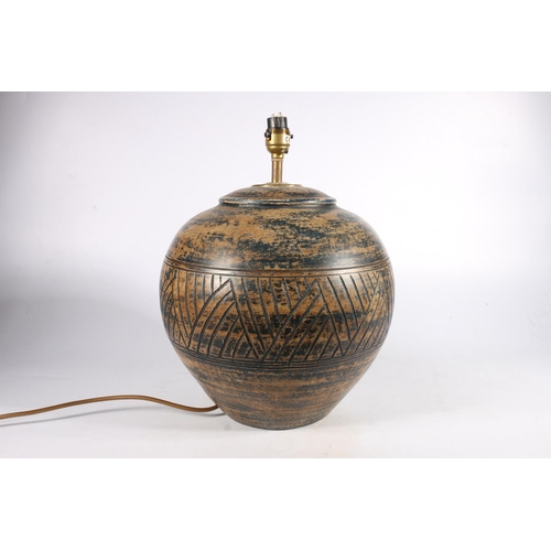 547 - Table lamp of squat bulbous incised form, 33cm