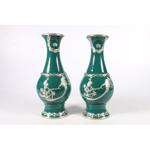 548 - Pair of white metal mounted baluster shaped vases, 22cm.