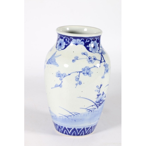 581 - Chinese baluster shaped blue and white vase with birds among flowers, 26cm.