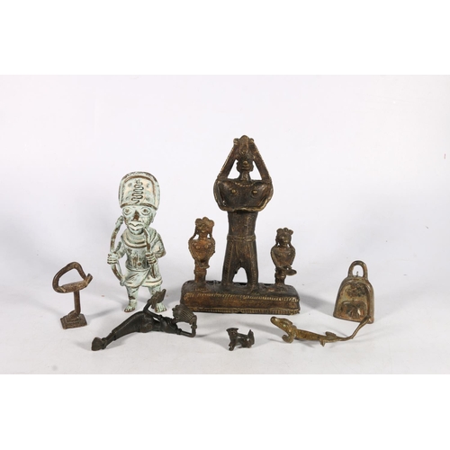 585 - Bronze and metal figures to include a warrior with bow and arrow and snakes on hat, 18cm, etc.