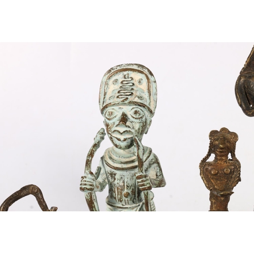 585 - Bronze and metal figures to include a warrior with bow and arrow and snakes on hat, 18cm, etc.