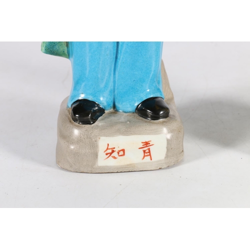 588 - Pair of Chinese cultural revolutionary female figurines modelled as a worker resting on spade and wo... 