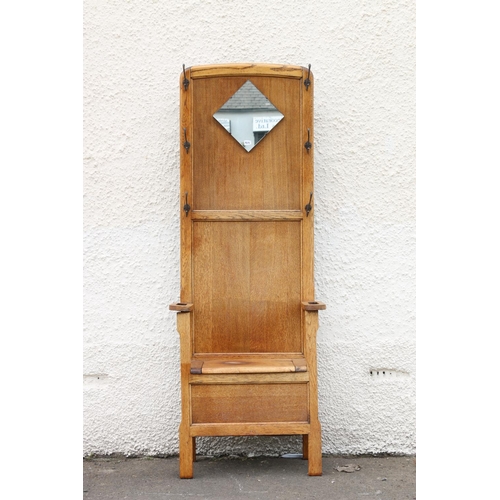 602 - Early 20th century Arts & Crafts oak hallstand, the twin panelled back flanked by six coat hooks... 