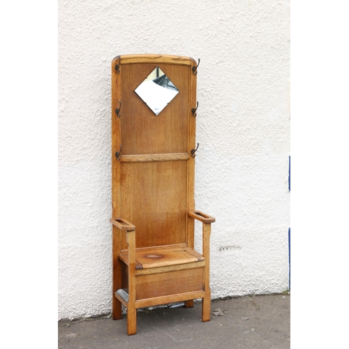 602 - Early 20th century Arts & Crafts oak hallstand, the twin panelled back flanked by six coat hooks... 