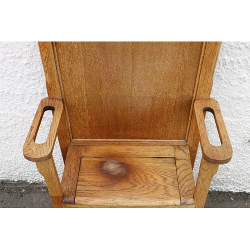 602 - Early 20th century Arts & Crafts oak hallstand, the twin panelled back flanked by six coat hooks... 