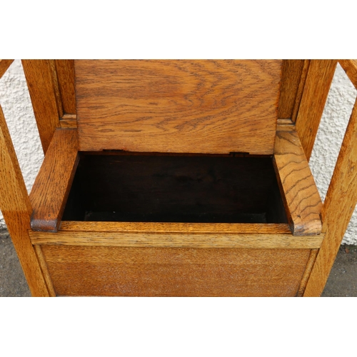 602 - Early 20th century Arts & Crafts oak hallstand, the twin panelled back flanked by six coat hooks... 